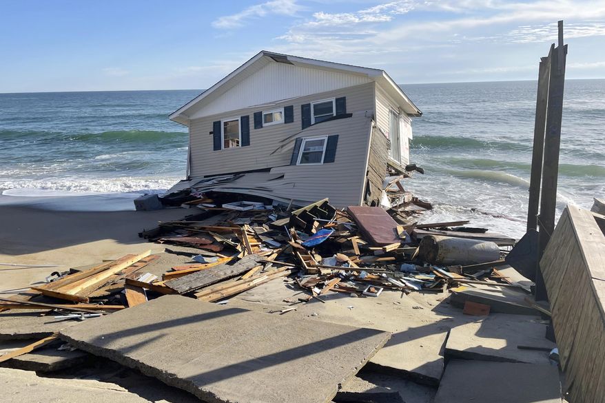 FILE - This image released by the National Park Service, shows a collapsed beachfront home along Ocean Drive in Rodanthe, N.C., on Wednesday, Feb. 9, 2022. The National Park Service issued a warning to visitors on Wednesday for debris. (National Park Service via AP, File)