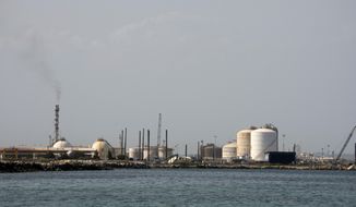 An external view of the ISAB refinery in Priolo-Gargallo near Syracuse, Sicily, Tuesday, May 31, 2022. The ISAB, owned by Russia’s Lukoil, employs 1,000 people directly and another 2,500 in related activities. In an ironic turn, Italy has increased its imports of Russian oil in a period when the rest of Europe has been slashing its purchases from Moscow, even before the sanctions. That’s because banks have refused to take the risk of extending credit to Russia-controlled ISAB that would allow them to buy oil from non-Russian sources, even if financial sanctions did not specifically bar them from doing so. (AP Photo/Gaetano Adriano Pulvirenti)