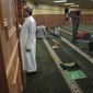 A member of the Abubakar As-Saddique Islamic Center recites the Islamic call to prayer, or adhan, on Thursday, May 12, 2022, in Minneapolis. The adhan exhorts men to go to the closest mosque five times a day for prayer, which is one of the Five Pillars of Islam. Abubakar, which hosts some 1,000 men for Friday midday prayers, plans to hold meetings with neighbors before publicly broadcasting publicly the call this summer. (AP Photo/Jessie Wardarski)