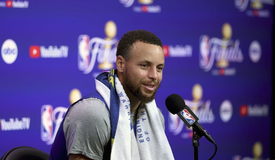 Golden State Warriors guard Stephen Curry speaks to members of the media during NBA basketball practice in San Francisco, Wednesday, June 1, 2022. The Warriors are scheduled to host the Boston Celtics in Game 1 of the NBA Finals on Thursday. (AP Photo/Jed Jacobsohn)