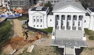 FILE - Workers begin digging a tunnel to connect the new General Assembly building to the Capitol, March 2, 2022, in Richmond, Va. Dena Potter, a spokeswoman for the state agency overseeing the project, said the Capitol was briefly evacuated on March 14, 2022, after a contractor working on the $25 million tunnel “inadvertently” poked through the ceiling of a subterranean Capitol extension causing debris to fall into the visitors center cafe. (AP Photo/Steve Helber, File)