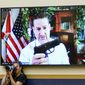 Rep. Greg Steube, R-Fla., holds up his own handgun as he speaks via videoconference as the House Judiciary Committee holds an emergency meeting to advance a series of Democratic gun control measures, called the Protecting Our Kids Act, in response to mass shootings in Texas and New York, at the Capitol in Washington, Thursday, June 2, 2022. (AP Photo/J. Scott Applewhite)