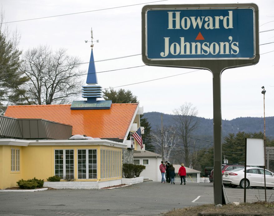 Customers walk into Howard Johnson's Restaurant in Lake George, N.Y., on April 8, 2015. The Howard Johnson's restaurant in this upstate New York resort village — the last of the once-pervasive eateries serving food under orange roofs with blue spires — is closed. (AP Photo/Mike Groll, File)