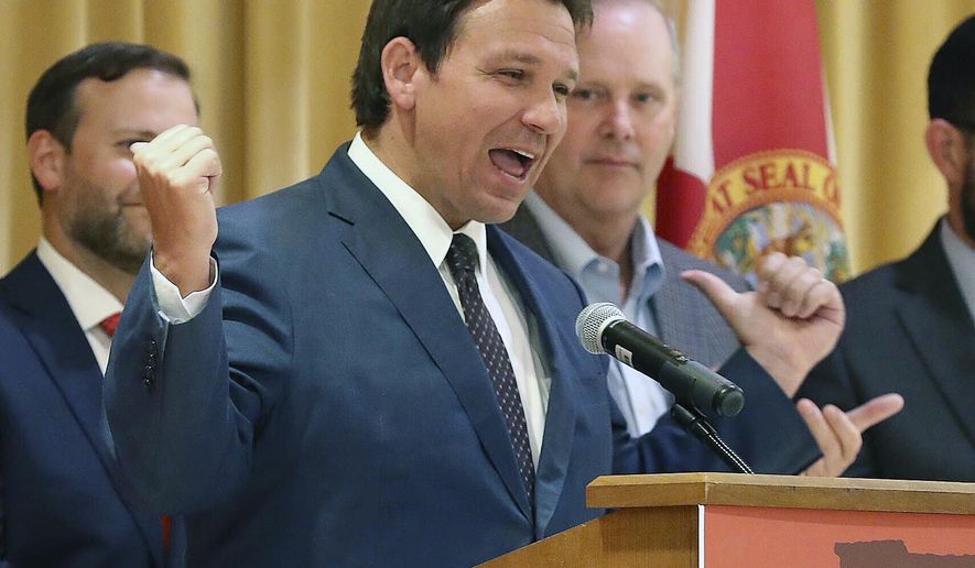 Florida Gov. Ron DeSantis speaks before he signs a record $109.9 billion state budget Thursday, June, 2, 2022 at The Villages, Fla. Florida Gov. Ron DeSantis on Thursday signed a $109.9 billion state budget bill that includes pay raises for state workers and law enforcement, as well as tax suspensions on gas, diapers and school supplies. (Stephen M. Dowell/Orlando Sentinel via AP)