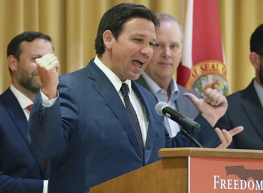 Florida Gov. Ron DeSantis speaks before he signs a record $109.9 billion state budget Thursday, June, 2, 2022 at The Villages, Fla. Florida Gov. Ron DeSantis on Thursday signed a $109.9 billion state budget bill that includes pay raises for state workers and law enforcement, as well as tax suspensions on gas, diapers and school supplies. (Stephen M. Dowell/Orlando Sentinel via AP)