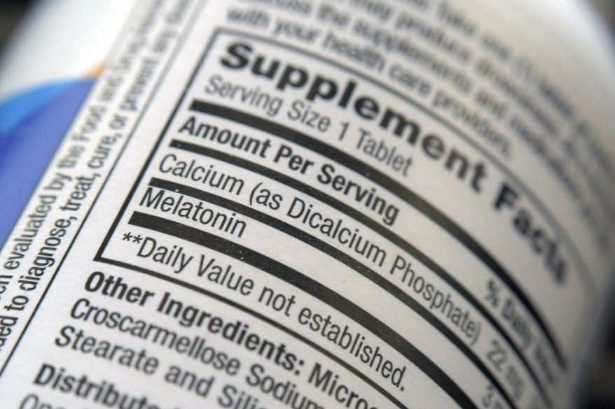 The label for a bottle of melatonin pills is seen in New York on Thursday, June 2, 2022. Melatonin is a hormone that helps control the body's sleep cycle. (AP Photo/Patrick Sison)