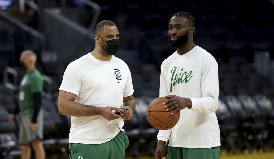 Boston Celtics guard Jaylen Brown, right, speaks with coach Ime Udoka during NBA basketball practice in San Francisco, Wednesday, June 1, 2022. The Golden State Warriors are scheduled to host the Celtics in Game 1 of the NBA Finals on Thursday. (AP Photo/Jed Jacobsohn) **FILE**