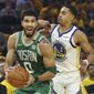 Boston Celtics forward Jayson Tatum (0) drives to the basket against Golden State Warriors guard Jordan Poole (3) during the first half of Game 1 of basketball&#39;s NBA Finals in San Francisco, Thursday, June 2, 2022. (AP Photo/Jed Jacobsohn)