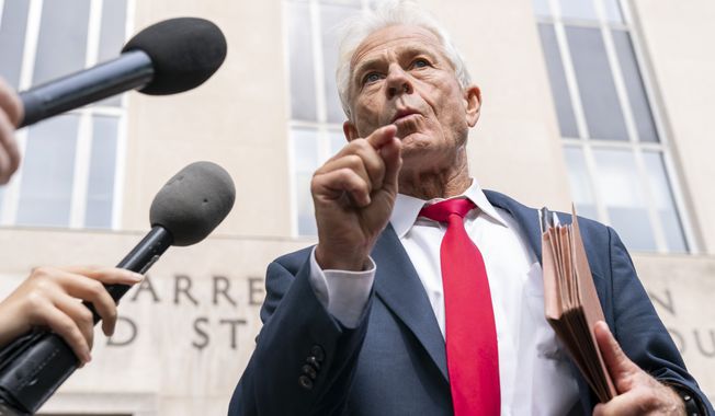 Former Trump White House official Peter Navarro speaks to reporters Friday, June 3, 2022, outside of federal court in Washington. Navarro was indicted Friday on contempt charges after defying a subpoena from the House panel investigating the Jan. 6 attack on the U.S. Capitol. (AP Photo/Jacquelyn Martin)