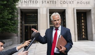 Former Trump White House official Peter Navarro speaks to reporters Friday, June 3, 2022, outside of federal court in Washington. Navarro was indicted Friday on contempt charges after defying a subpoena from the House panel investigating the Jan. 6 attack on the U.S. Capitol. (AP Photo/Jacquelyn Martin)