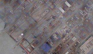 This satellite image provided by Planet Labs PBC shows construction of China&#39;s Type 003 aircraft carrier at the Jiangnan Shipyard northeast of Shanghai, China, Tuesday, May 31, 2022.  China’s most advanced aircraft carrier to date appears to be nearing completion, satellite photos analyzed by The Associated Press showed Friday, June 3, as experts suggested the vessel could be launched soon. (Planet Labs PBC via AP)