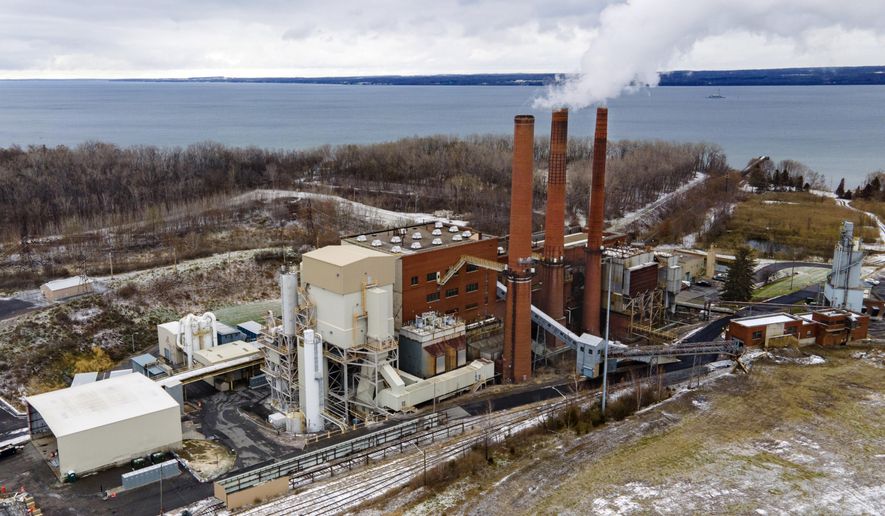 FILE - The Greenidge Generation bitcoin mining facility, in a former coal plant by Seneca Lake in Dresden, New York, is shown in this photo from Nov. 29, 2021. A milestone measure that would tap the brakes on the spread of cryptocurrency mining operations burning fossil fuels in New York has passed the state Legislature. The bill approved early Friday, June 3, 2022,  by the state Senate would establish a two-year moratorium on new and renewed air permits for fossil fuel power plants used for energy-intensive “proof-of-work” cryptomining. The plant also produces power for the state&#39;s electricity grid. (AP Photo/Ted Shaffrey, File)