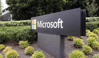 The Microsoft company logo is displayed at their offices in Sydney, on Feb. 3, 2021. Stocks are off to a mixed start on Wall Street Thursday, June 2, 2022, as weakness in technology companies offsets gains elsewhere in the market. Microsoft weighed down the tech sector with a 3% loss after cutting its financial forecasts for the current quarter, citing unfavorable changes in exchange rates. (AP Photo/Rick Rycroft) **FILE**