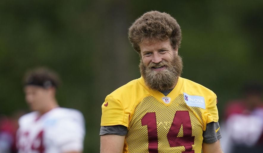 Washington Football Team quarterback Ryan Fitzpatrick attends an NFL football practice, Tuesday, Aug. 17, 2021, in Ashburn, Va. Quarterback Ryan Fitzpatrick confirmed to The Associated Press on Friday, June 3, 2022, that he informed former teammates of his intention to retire a day earlier. Former Bills running back Fred Jackson first announced the news of Fitzpatrick’s retirement on his Twitter account by posting an image and message from his former Buffalo teammate. The 39-year-old Fitzpatrick’s career ends after a brief stint in Washington. (AP Photo/Patrick Semansky, File) **FILE**
