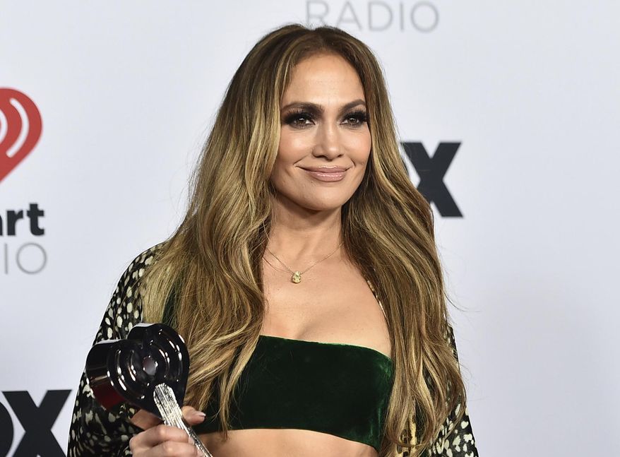 Jennifer Lopez appears in the press room with the Icon Award at the iHeartRadio Music Awards in Los Angeles on March 22, 2022. Lopez will be honored for her film and television achievements at the MTV Movie & TV Awards. The network announced Friday that Lopez will receive the Generation Award on Sunday in Santa Monica, Calif. (Photo by Jordan Strauss/Invision/AP, File)