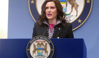 Michigan Gov. Gretchen Whitmer speaks at a news conference on Friday, March 11, 2022, at the governor&#39;s office in Lansing, Mich. Whitmer&#39;s office says she was on a list of targets of a gunman who fatally shot a man in Wisconsin. (AP Photo/David Eggert, File)