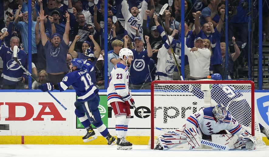 Tampa Bay Lightning left wing Ondrej Palat (18) reacts after scoring past New York Rangers goaltender Igor Shesterkin (31) during the third period in Game 3 of the NHL hockey Stanley Cup playoffs Eastern Conference finals Sunday, June 5, 2022, in Tampa, Fla. (AP Photo/Chris O&#39;Meara)