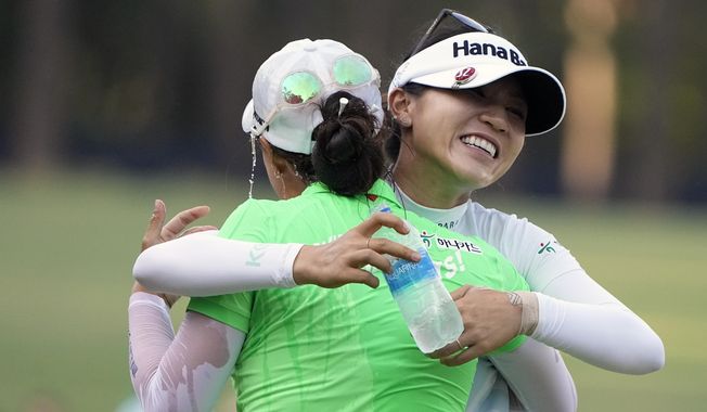 Minjee Lee, of Australia, left embraces Lydia Ko, of New Zealand, after the final round of the U.S. Women&#x27;s Open golf tournament at the Pine Needles Lodge &amp;amp; Golf Club in Southern Pines, N.C., on Sunday, June 5, 2022. Minjee Lee won the match. (AP Photo/Chris Carlson)