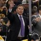 Boston Bruins head coach Bruce Cassidy, center, gestures during the third period of an NHL hockey game against the Pittsburgh Penguins, April 16, 2022, in Boston. The Bruins have fired Cassidy several weeks after losing in the first round of the playoffs. (AP Photo/Winslow Townson, File) **FILE**