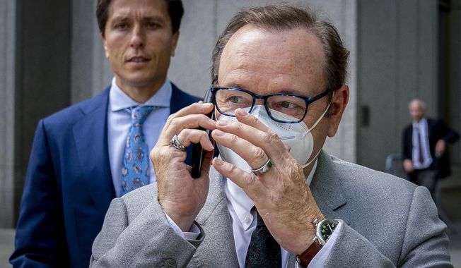 Actor Kevin Spacey appears to talk in his phone as he leaves court after testifying in a civil lawsuit, Thursday, May 26, 2022, in New York. A sex-assault civil lawsuit against Spacey can proceed in federal court in New York City, a federal judge ruled Monday, June 6. (AP Photo/John Minchillo, File)
