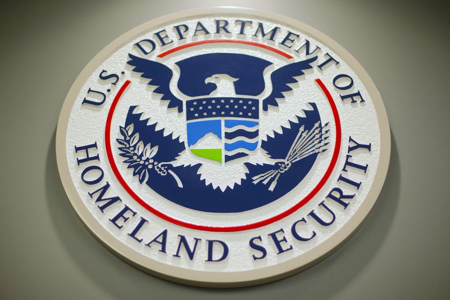 The Department of Homeland Security logo is seen during a news conference in Washington, Feb. 25, 2015. DHS says a looming Supreme Court decision on abortion, an increase of migrants at the U.S.-Mexico border and the midterm elections are potential triggers for extremist violence over the next six months. DHS said June 7, 2022, in the National Terrorism Advisory System bulletin the U.S. was in a &quot;heightened threat environment&quot; already and these factors may worsen the situation. (AP Photo/Pablo Martinez Monsivais, File)
