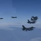 In this photo provided by South Korea Defense Ministry, U.S. and South Korea Air Force fighter jets fly in formation during a joint drill on Tuesday, June, 7, 2022. The South Korean and U.S. militaries flew 20 fighter jets over South Korea&#39;s western sea Tuesday in a continued show of force as a senior U.S. official warned of a forceful response if North Korea goes ahead with its first nuclear test explosion in nearly five years. (South Korea Defense Ministry via AP) **FILE**
