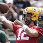 Green Bay Packers&#x27; Aaron Rodgers runs a drill at the NFL football team&#x27;s practice field Tuesday, June 7, 2022, in Green Bay, Wis. (AP Photo/Morry Gash)