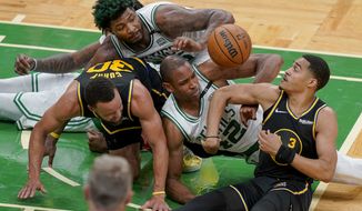Boston Celtics center Al Horford (42) and guard Marcus Smart, top, battle for a loose ball against Golden State Warriors guard Jordan Poole (3) and guard Stephen Curry (30) during the fourth quarter of Game 3 of basketball&#39;s NBA Finals, Wednesday, June 8, 2022, in Boston. (AP Photo/Steven Senne)