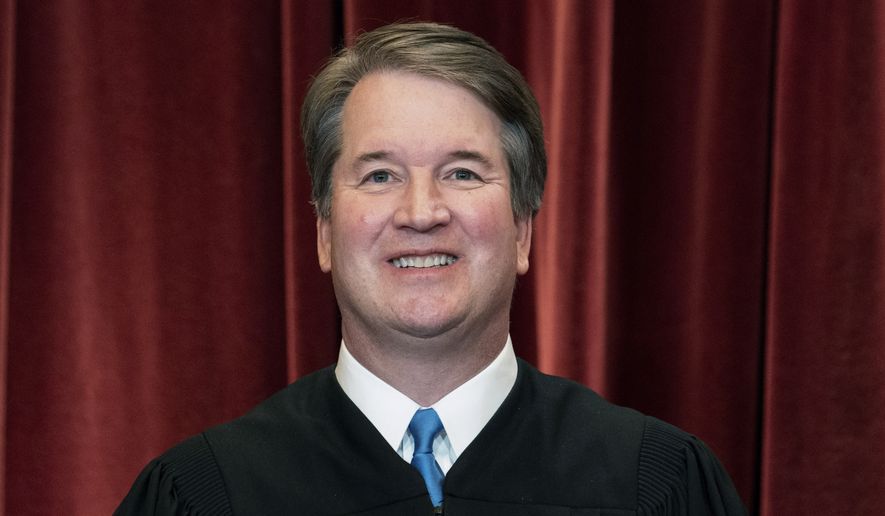 Associate Justice Brett Kavanaugh stands during a group photo at the Supreme Court in Washington, on April 23, 2021. (Erin Schaff/The New York Times via AP, Pool)  **FILE**
