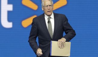Walmart Chairman Rob Walton speaks at the company shareholders meeting in Fayetteville, Ark., June 5, 2015. The Walton family has won the bidding to purchase the Denver Broncos in the most expensive deal for a sports franchise anywhere in the world. The Broncos announced late Tuesday night, June 7, 2022, that they had entered into a sale agreement with the Walton-Penner ownership group led by Walmart heir Rob Walton, his daughter, Carrie Walton Penner, and her husband, Greg Penner. (AP Photo/Danny Johnston, File)