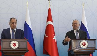 Turkish Foreign Minister Mevlut Cavusoglu, right, talks to journalists next to Russian Foreign Minister Sergey Lavrov during a joint news conference in Ankara, Wednesday, June 8, 2022. (AP Photo/Burhan Ozbilici)