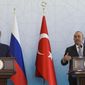 Turkish Foreign Minister Mevlut Cavusoglu, right, talks to journalists next to Russian Foreign Minister Sergey Lavrov during a joint news conference in Ankara, Wednesday, June 8, 2022. (AP Photo/Burhan Ozbilici)