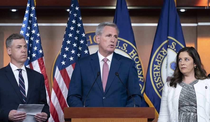 House Minority Leader Kevin McCarthy, of Calif., center, speaks during a news conference on the House Jan. 6 Committee, Thursday, June 9, 2022, with Rep. Jim Banks, R-Ind., left, and Rep. Elise Stefanik, R-N.Y., on Capitol Hill in Washington. (AP Photo/Jacquelyn Martin)