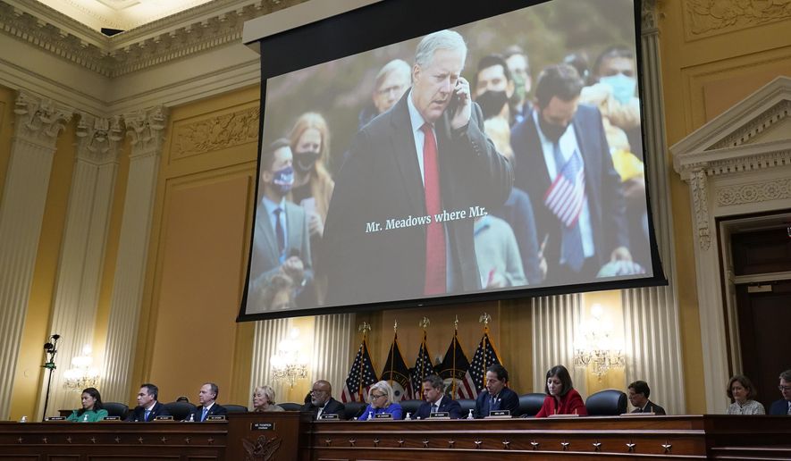 An image of former White House Chief of Staff Mark Meadows is shown as committee members from left to right, Rep. Stephanie Murphy, D-Fla., Rep. Pete Aguilar, D-Calif., Rep. Adam Schiff, D-Calif., Rep. Zoe Lofgren, D-Calif., Chairman Bennie Thompson, D-Miss., Vice Chair Liz Cheney, R-Wyo., Rep. Adam Kinzinger, R-Ill., Rep. Jamie Raskin, D-Md., and Rep. Elaine Luria, D-Va., look on, as the House select committee investigating the Jan. 6 attack on the U.S. Capitol holds its first public hearing to reveal the findings of a year-long investigation, at the Capitol in Washington, Thursday, June 9, 2022. (AP Photo/J. Scott Applewhite)