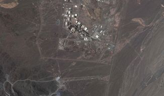This satellite image from Planet Labs PBC shows Iran&#39;s underground Natanz nuclear site, as well as ongoing construction to expand the facility in a nearby mountain to the south, near Natanz, Iran, May 9, 2022. Iran plans to install two new cascades of advanced centrifuges at Natanz that will allow Tehran to rapidly enrich more uranium, the U.N.&#39;s nuclear watchdog said Thursday, June 9, 2022, the latest escalation in the standoff over the country&#39;s atomic program. (Planet Labs PBC via AP)
