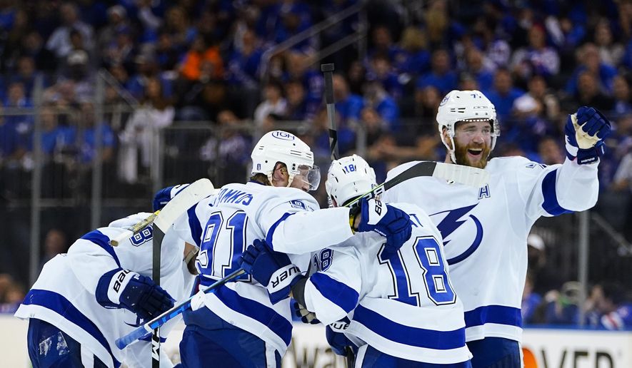 The Tampa Bay Lightning celebrate a goal during the third period against the New York Rangers in Game 5 of the NHL Hockey Stanley Cup playoffs Eastern Conference Finals, Thursday, June 9, 2022, in New York (AP Photo/Frank Franklin II)