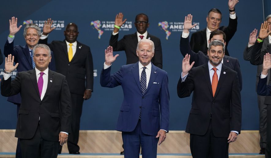 President Joe Biden, center participates in a family photo beside Colombian President Ivan Duque, left, and Paraguay President Mario Abdo Benitez and other heads of delegations at the Summit of the Americas, Friday, June 10, 2022, in Los Angeles. (AP Photo/Evan Vucci)