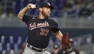 Washington Nationals starting pitcher Stephen Strasburg (37) aims a pitch during the first inning of a baseball game against the Miami Marlins, Thursday, June 9, 2022, in Miami. (AP Photo/Marta Lavandier) **FILE**