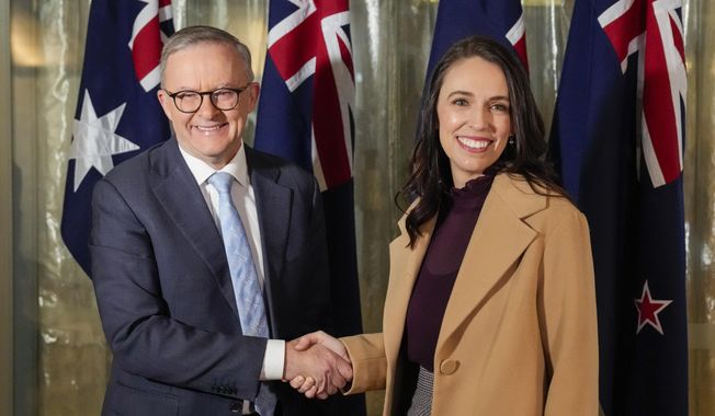 New Zealand Prime Minister Jacinda Ardern, right, shakes hands with Australian Prime Minister Anthony Albanese ahead of a bilateral meeting in Sydney, Australia, Friday, June 10, 2022. Ardern is on a two-day visit to Australia. (AP Photo/Mark Baker, Pool)