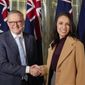 New Zealand Prime Minister Jacinda Ardern, right, shakes hands with Australian Prime Minister Anthony Albanese ahead of a bilateral meeting in Sydney, Australia, Friday, June 10, 2022. Ardern is on a two-day visit to Australia. (AP Photo/Mark Baker, Pool)
