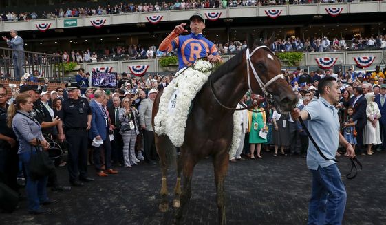 Mo Donegal, with jockey Irad Ortiz Jr., is paraded in the winner&#39;s circle after victory in the 154th running of the Belmont Stakes horse race, Saturday, June 11, 2022, at Belmont Park in Elmont, N.Y. (AP Photo/Eduardo Munoz)