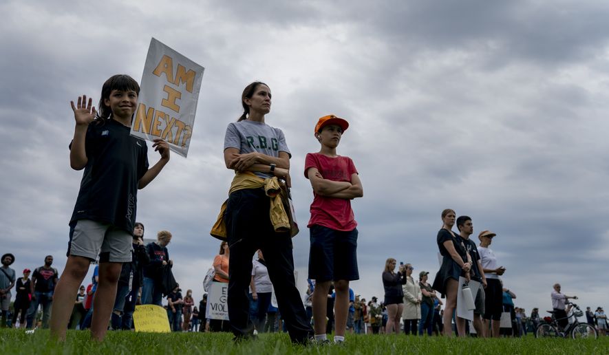 A child participates in the second March for Our Lives rally in support of gun control Saturday, June 11, 2022, in Washington. The rally is a successor to the 2018 march organized by student protestors after the mass shooting at a high school in Parkland, Fla. (AP Photo/Gemunu Amarasinghe)
