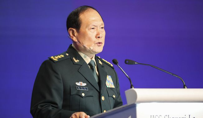 China&#x27;s Defense Minister Gen. Wei Fenghe speaks at a plenary session during the 19th International Institute for Strategic Studies (IISS) Shangri-la Dialogue, Asia&#x27;s annual defense and security forum, in Singapore, Sunday, June 12, 2022. (AP Photo/Danial Hakim)