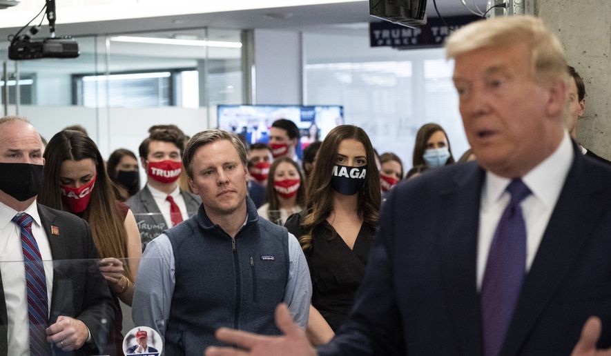 Campaign manager Bill Stepien, left, watches as President Donald Trump speaks at his campaign headquarters in Arlington, Va., on Election Day, Tuesday, Nov. 3, 2020. (AP Photo/Alex Brandon, File)
