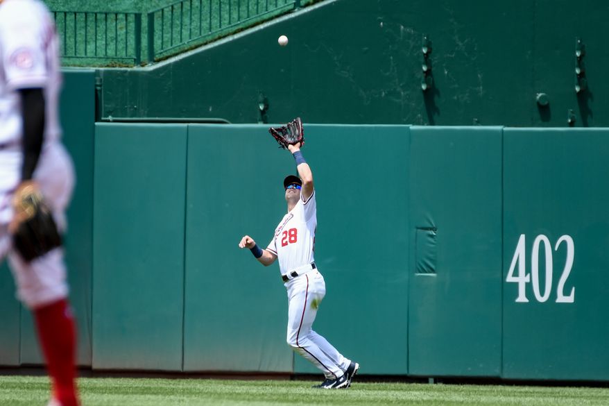 Washington Nationals centerfielder Lane Thomas (28) catching a ball off the bat of Milwaukee Brewers left fielder Christian Yelich (22) during the 3rd inning at Nationals Park in Washington D.C., June 12, 2022. (Photo by All-Pro Reels)