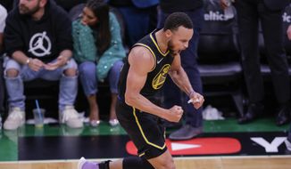 Golden State Warriors&#x27; Stephen Curry, 30, reacts after hitting a three pointer during the fourth quarter of Game 4 of basketball&#x27;s NBA Finals, in Boston, Mass., on Friday, June 10, 2022. (Carlos Avila Gonzalez/San Francisco Chronicle via AP) **FILE**