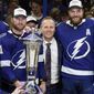 Tampa Bay Lightning center Steven Stamkos (91), head coach Jon Cooper, and defenseman Victor Hedman (77) pose with the Prince of Wales Trophy after the team defeated the New York Rangers during Game 6 of the NHL hockey Stanley Cup playoffs Eastern Conference finals Saturday, June 11, 2022, in Tampa, Fla. (AP Photo/Chris O&#x27;Meara) **FILE**