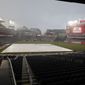 Nationals Park is viewed during a rain delay before a baseball game between the Washington Nationals and the Atlanta Braves, Monday, June 13, 2022, in Washington. (AP Photo/Luis M. Alvarez)