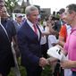 Rory McIlroy, front right, shakes hands with PGA Commissioner Jay Monahan after winning the Canadian Open golf tournament in Toronto, Sunday, June 12, 2022. (Frank Gunn/The Canadian Press via AP) **FILE**