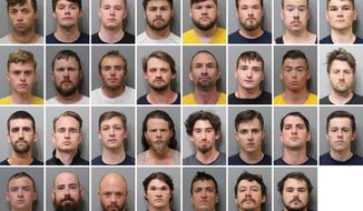 These booking images provided by the Kootenai County Sheriff’s Office show the 31 members of the white supremacist group Patriot Front who were arrested after they were found packed into the back of a U-Haul truck with riot gear near an LGBTQ pride event in Coeur d’Alene, Idaho, on Saturday, June 11, 2022. Top row, from left, are Jared Boyce, Nathan Brenner, Colton Brown, Josiah Buster, Mishael Buster, Devin Center, Dylan Corio, and Winston Durham. Second row, from left, are Garret Garland, Branden Haney, Richard Jessop, James Julius Johnson, James Michael Johnson, Connor Moran, Kieran Morris and Lawrence Norman. Third row, from left, are Justin O&#39;leary, Cameron Pruitt, Forrest Rankin, Thomas Rousseau, Conor Ryan, Spencer Simpson, Alexander Sisenstein and Derek Smith. Bottom row, from left, are Dakota Tabler, Steven Tucker, Wesley Van Horn, Mitchell Wagner, Nathaniel Whitfield, Graham Whitsom and Robert Whitted. (Kootenai County Sheriff’s Office via AP)